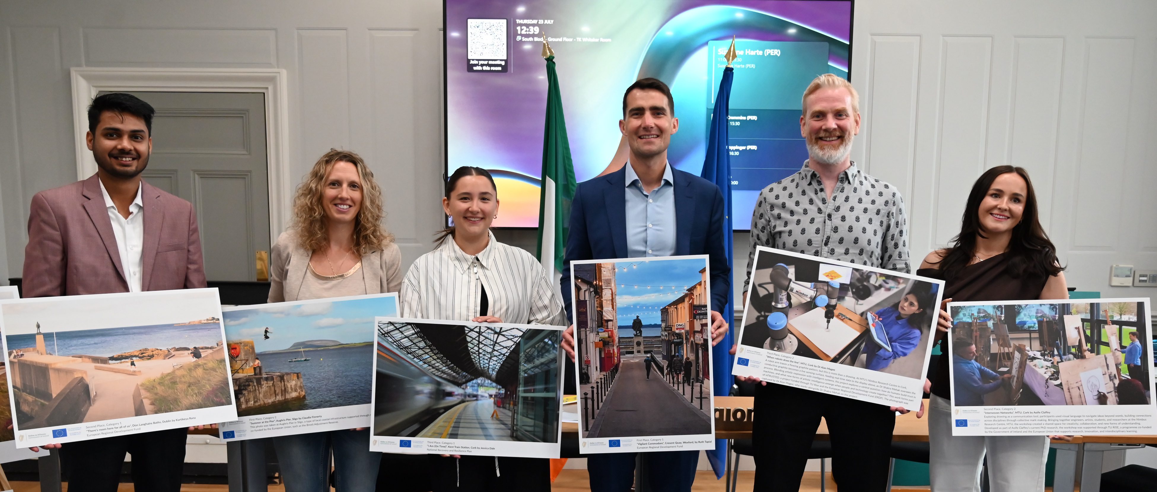 Winners holding their photos L to R: Kartikeya Rana, Claudia Finnerty, Jessica Dale, Minister Chambers holding Ruth Tapial's photo, Dr Alan Magee and Aoife Claffey